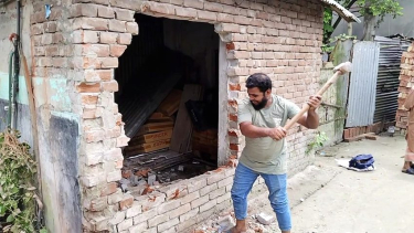 মধুখালী পৌর বাজারে অবৈধ স্থাপনা উচ্ছেদে অভিযান